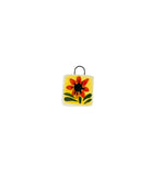 red and yellow ceramic charm